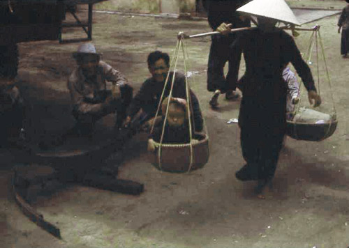 30. Phan Rang Joint Town Patrol. Market Photo by: SSgt John Achelpohl. 1966. Note toddler in the basket!