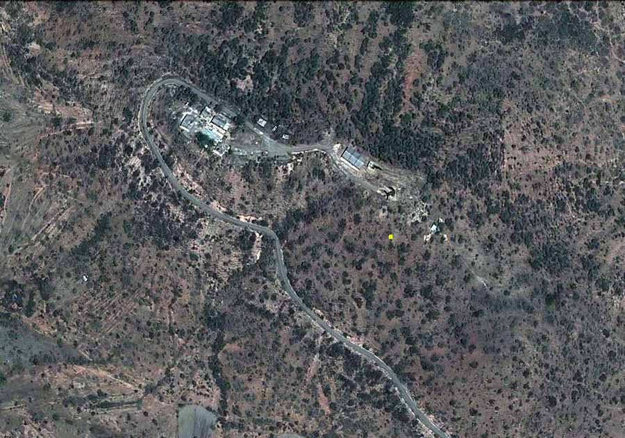 5. Google Satellite image (current). Nui Dat hill, overhead view. Yellow dot marks 180.30 meters high.