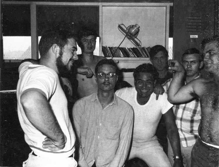 8. Nui Dat: 35th SPS tent-huts 1967. Seems that group pictures generally had someone flipping the bird. In this case, the guy in the pladd shirt is yours truly. Photo by Stan Reeves, ND 1967.