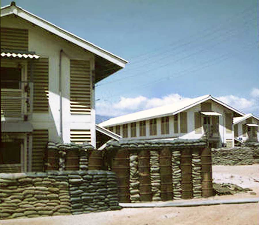 10. Nui Dat: 35th SPS. With barracks construction, followed sandbag detail and bunkers. I wonder what the barrels had contained? Photo by Stan Reeves, ND 1967.